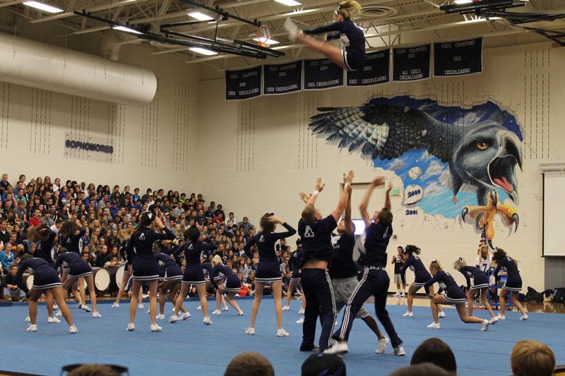 Cheerleader, Krista McPherson, flies high during Fridays Blue and Silver Assembly!