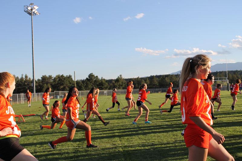 The Junior Powderpuff team stretches before the game. 