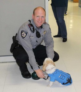 Deputy Herman and his dog both wear police badges for Halloween.
