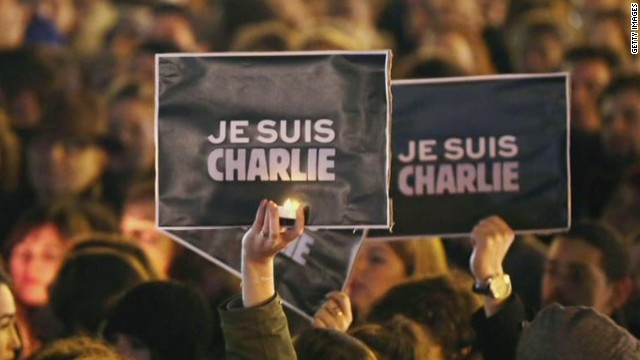 Parisian+citizens+mourn+the+Charlie+Hebdo+victims+with+the+statement+Je+Suis+Charlie.
