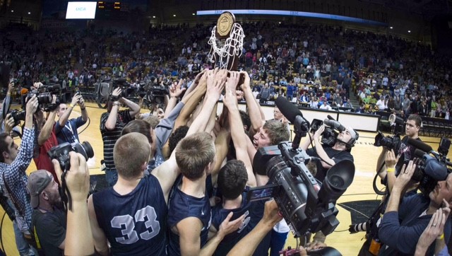 After+upsetting+undefeated+Longmont%2C+the+boys+basketball+team+celebrates+their+Cinderella+story+win%2C+holding+up+the+well-deserved+trophy.+Photo+via+Bailey+Sexton.