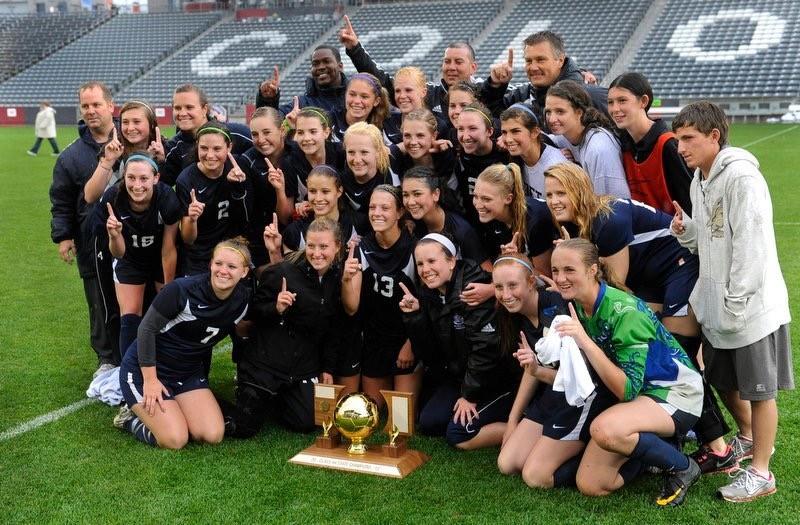 The air academy girls soccer team posing with their trophy following their 2012 4A state championship win. Photo via Sasha Kandrach
