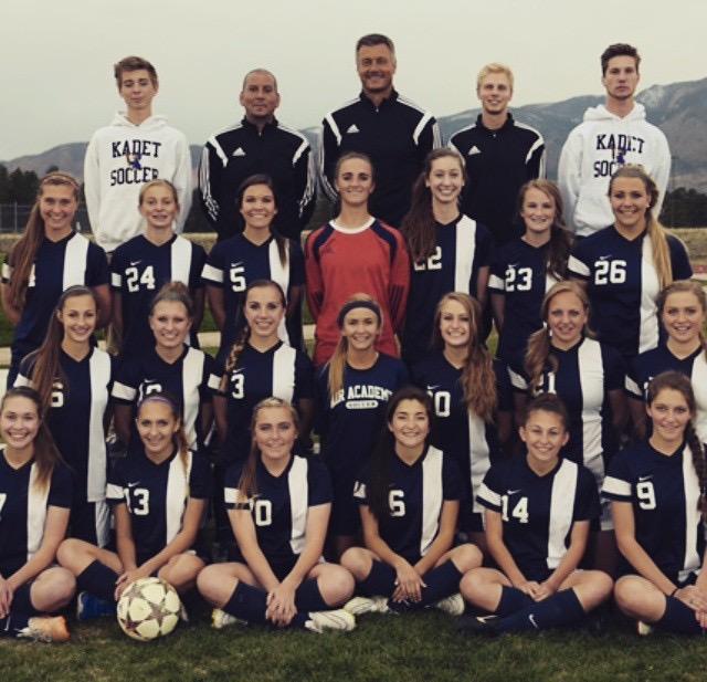 The girls soccer team takes a group picture before a game.

 Photo via Sierra Daniger