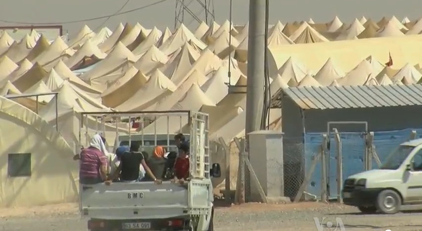   Syrian Refugee Camp on Turkish Border. Photo via Wikimedia under the Creative Commons License. https://upload.wikimedia.org/wikipedia/commons/5/52/Syrian_refugee_camp_on_theTurkish_border.jpg.