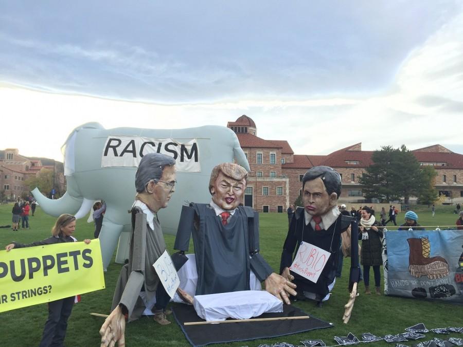 Silent protesters. Photo taken by Jessica Hendricks used with permission of people outside of GOP Debate in Boulder.