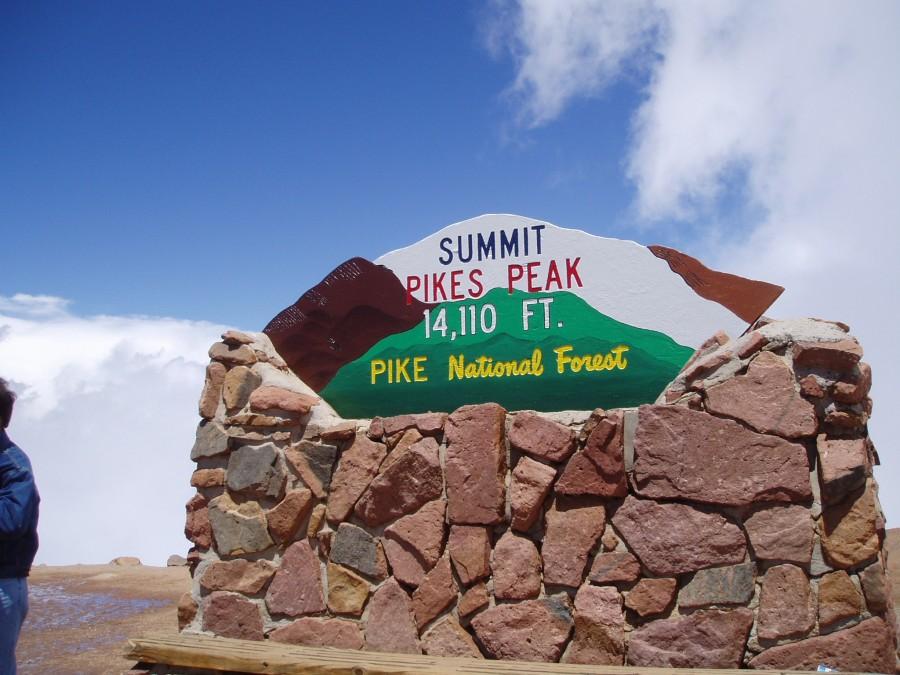 Sign at the top of Pikes Peak. Photo via Wikipedia under the Creative Commons License. (https://commons.wikimedia.org/wiki/File:Pikes_Peak_sign.jpg)