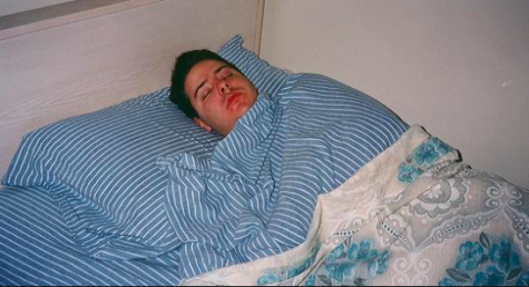 If this was you this winter break, it is time to face reality. Photo Via Wikimedia Commons under the Creative Commons License. [ https://commons.wikimedia.org/wiki/File:Man_sleeping_striped-sheets.JPG ]