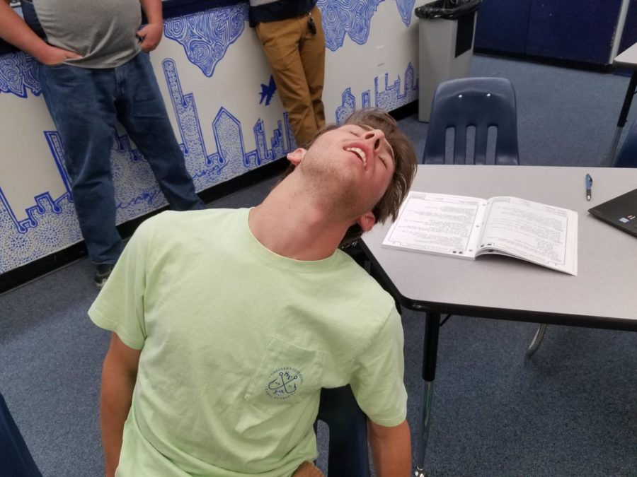 Senior Carter Rodny cant help but take a snooze after a late night of doing homework. Original photo by Jonathan Flat.