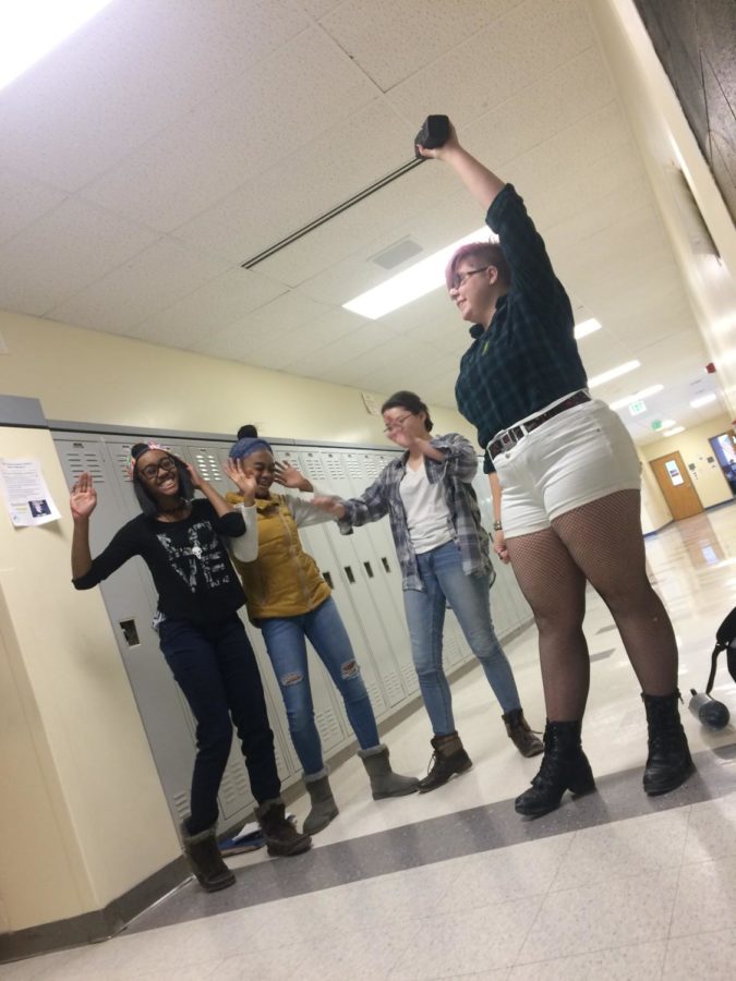 Students rock out to blaring music in D building. 
Left to right: Kamiyah Corinaldi, Kaley Corinaldi, Jayci Richardson, Skye Cook.