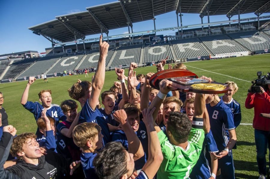 Boys Soccer team raises up State Championship after winning an incredible game.