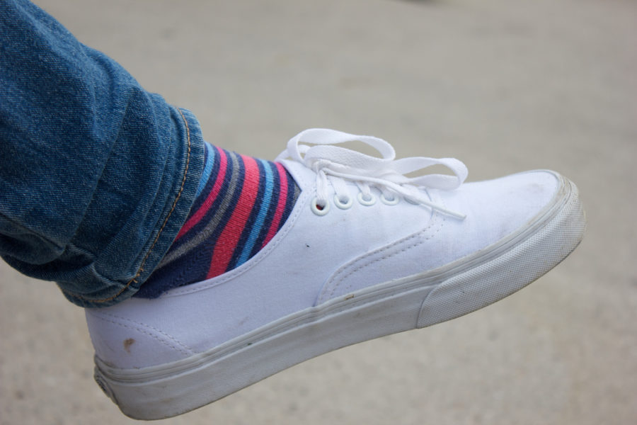 AAHS junior shows off his white vans and colored socks.