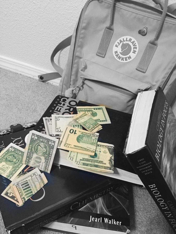 The necessities for college: a backpack, textbooks and a lot of cash.