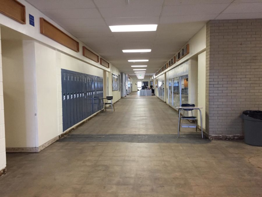 A building in Air Academy High School remains without proper flooring, for now.