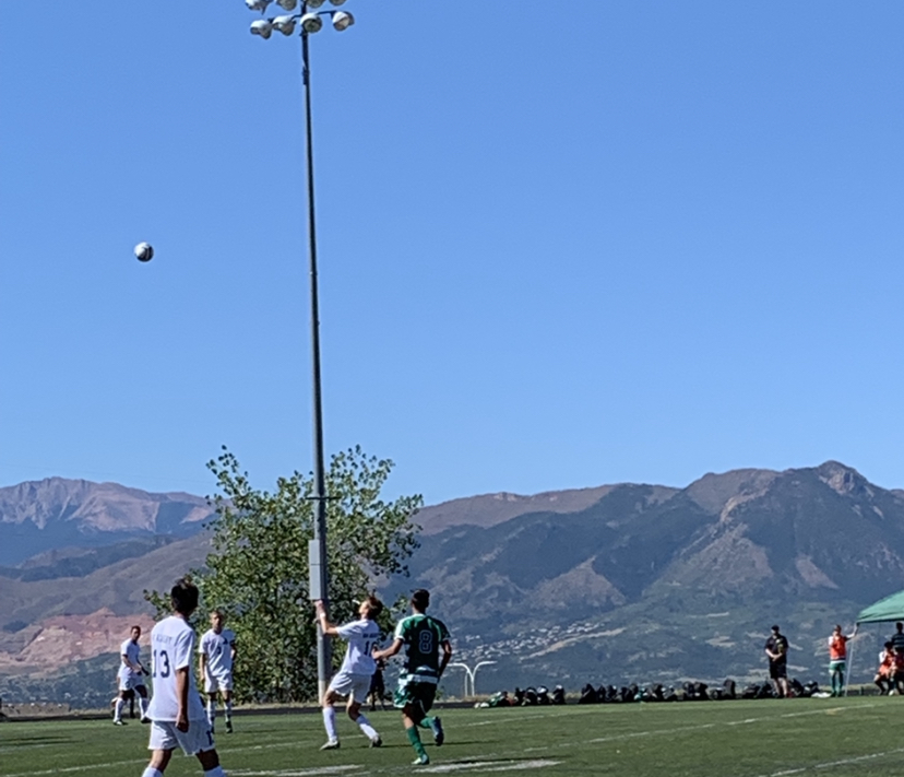 Joel Rapp (10), a foreign exchange student at Air Academy, going up for a header in the varsity soccer game against Pine Creek.