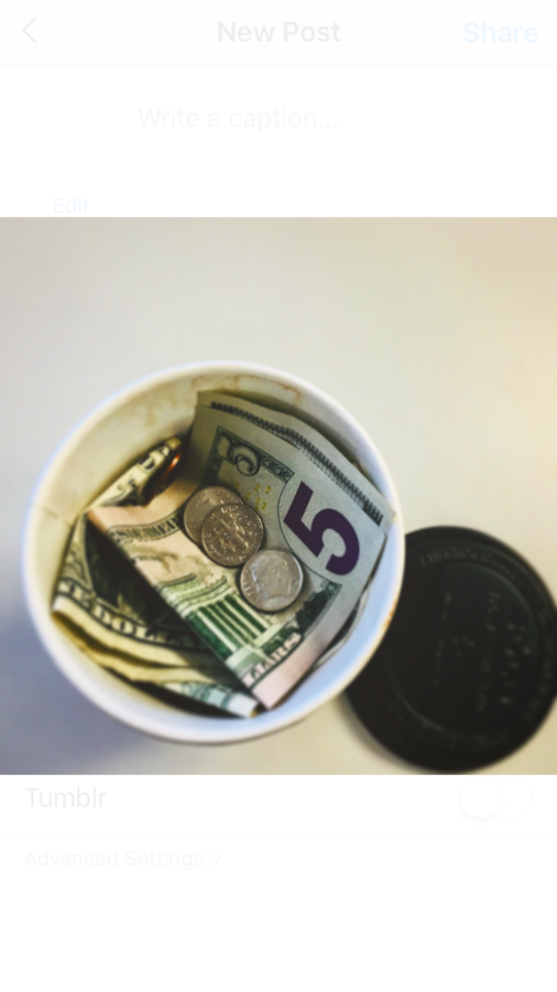 A Coffee cup full of money representing how much students spend on Coffee.
