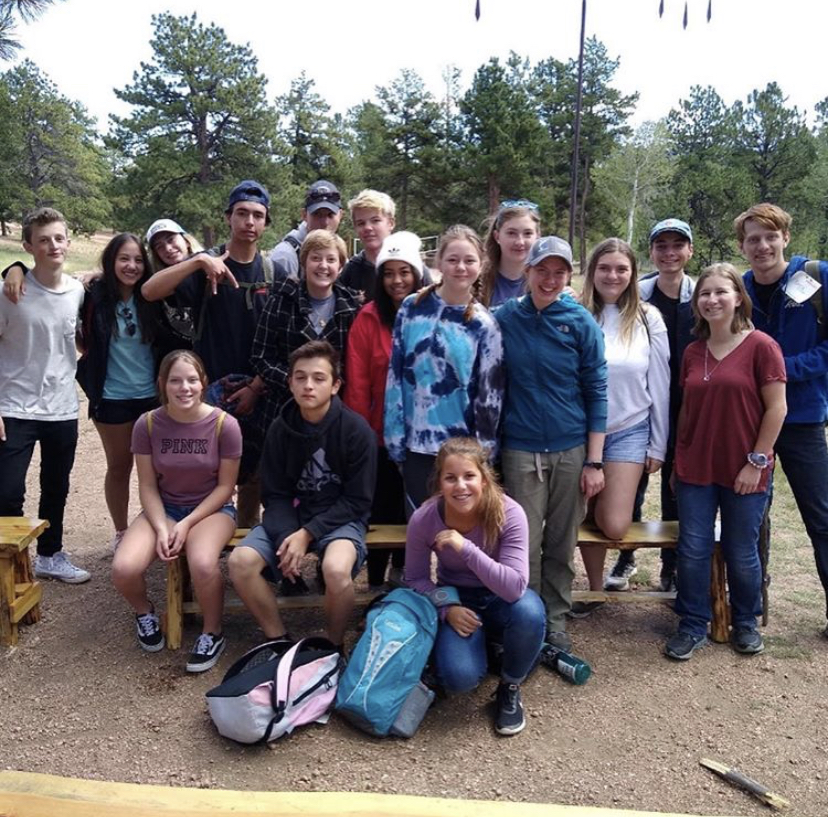 Nate Riggs poses for a photo alongside other counselors from across District 20 for the 2018 High Trails trip. Photo taken by senior, Nate Riggs.