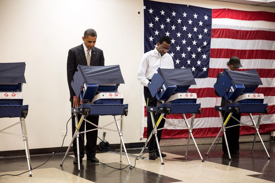 Barack Obama votes before his election in 2012. Labeled for reuse by Wikimedia Commons.