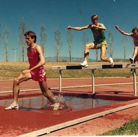 Sporting a cool mustache, Schwartz  runs in the lead of a 3000 meter steeple chase he won in Albuquerque (1990).