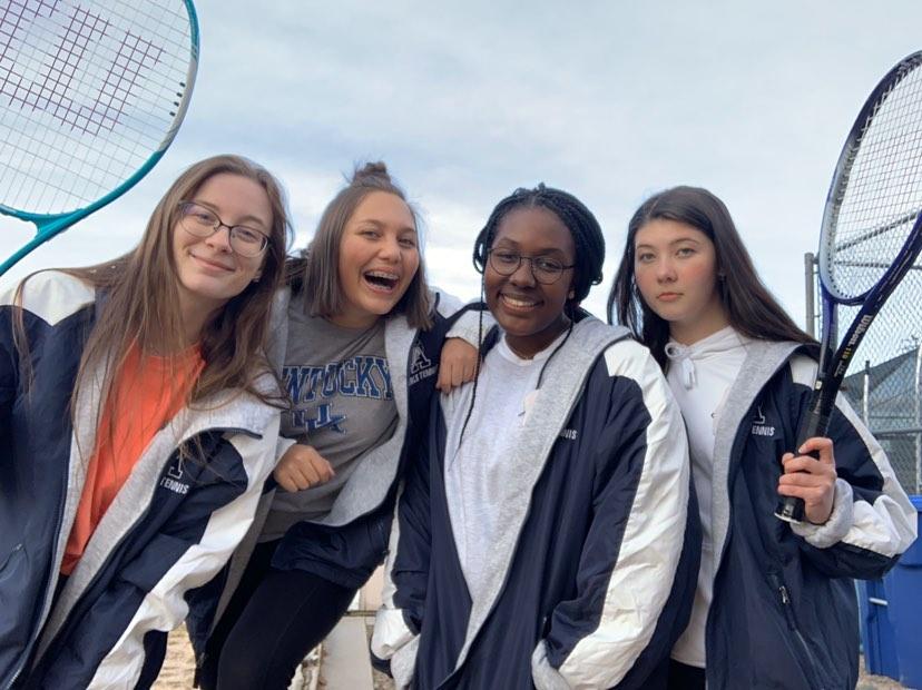 [Left to Right] Savannah Huyveart, Alyssa Martin, Ashlyn Johnson and Lydia McCann pose for a picture after Tennis practice at Air Academy High School.