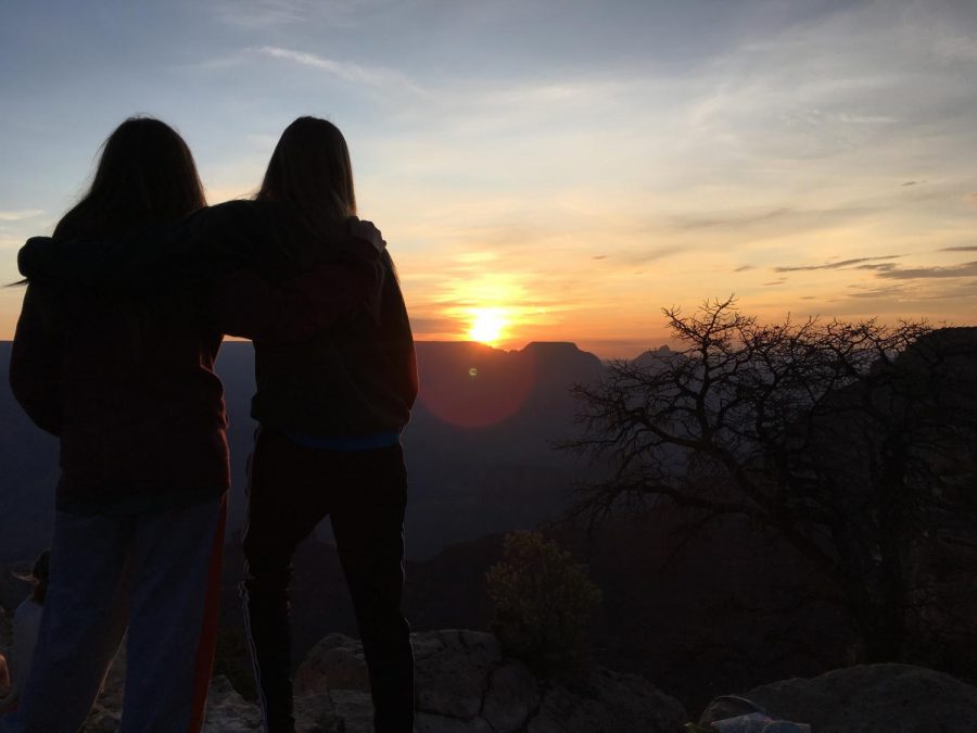 Junior Mia Belmear and her cousin watch the sunset atop the Grand Canyon. 