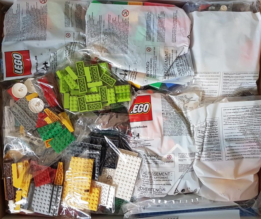 Labeled for reuse by Creative Commons license. LEGOS are shown as they are being unpackaged.