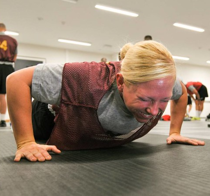 A women doing a push-up. Labeled for reuse on Creative Commons.