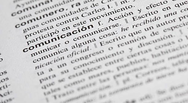 Labeled for Reuse under Getty Images. A translation from English to Spanish is provided in this descriptive book, including common words such as comunicación (communication). 
