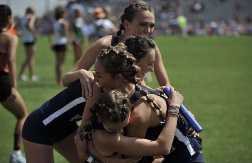 Cross Country runner Bethany Michalak celebrates with her team! Photo taken by Lori Mickalak