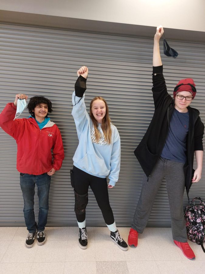 3 students holding masks, (left) Joseph Bradford (middle) Marley Bailey (right) Ethan Miller. Taken by Michael Anderson 