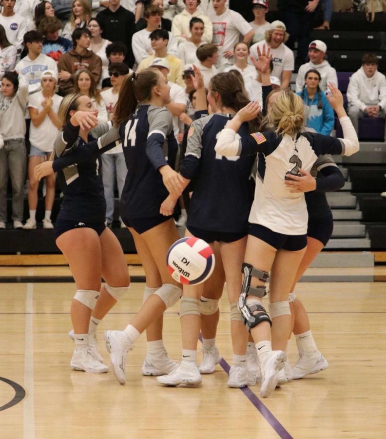 Volleyball team makes a decisive play to win point against DCC
