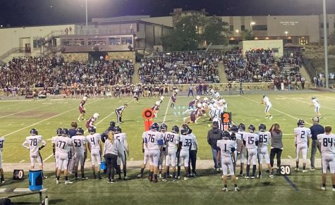 The AAHS football team playing against Cheyenne Mountain at an away game.