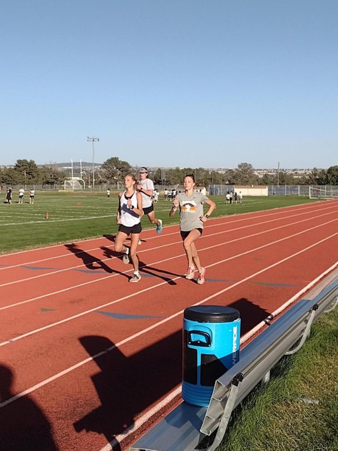 Air+Academy+runners+running+strides%2C+or+short+accelerations%2C+at+practice.+From+left+to+right%3A+Isaac+Buttery%2812%29%2C+Olivia+Chura%2810%29%2C+Lauren+Myers%289%29.
