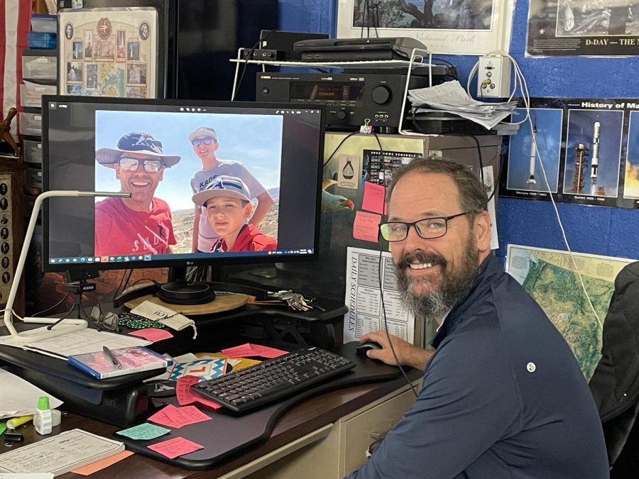 History teacher, Ronald Gorr, looking at photos of him and his children