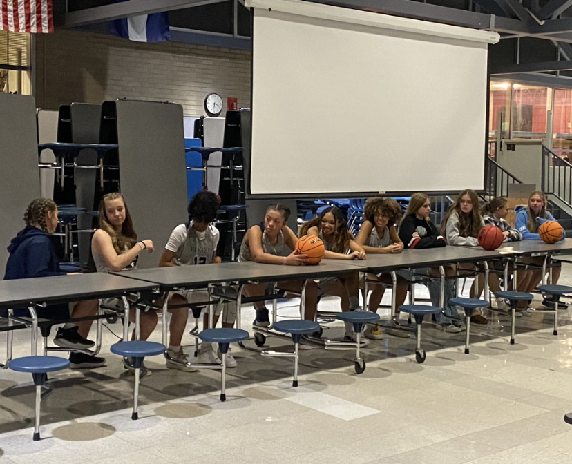 Shown+is+the+JV+Girls+Basketball+team+%28from+left+to+right%3A+sophomore+Indy+Danks%2C+freshmen+Rosa+Harmes%2C+freshmen+Olivia+Prince%2C+freshmen+Taylor+Hagins%2C+sophomore+Amiah+Damerell%2C+sophomore+Rehven+Wilkins%2C+freshmen+Ellyson+Siebert%2C+sophomore+Lydia+Moore%2C+sophomore+Liza+Clark%2C+and+sophomore+Langley+Grow%29+bonding+together+during+their+media+day+in+Air+Academys+cafeteria.%0A
