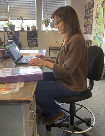 Language Arts teacher, Mary Anderson, looks ecstatic as she plans for a new lesson. Photo captured by Mia Holland.