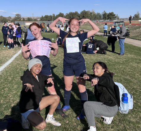 Pictured are sophomores Emma Fisher (top left), Farrah Dozier (top right), Rehven Wilkins (bottom left), and Amiah Damerell (bottom right) posing on the Air Academy grass fields after the last girl’s soccer game of the 2022-2023 season.
