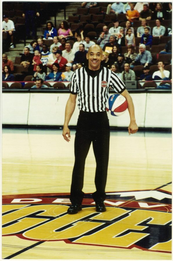 Pictured+is+referee+Bill+Cooper+standing+and+posing+with++basketball+in+hand+at+the+Ball+Arena+in+Denver.
