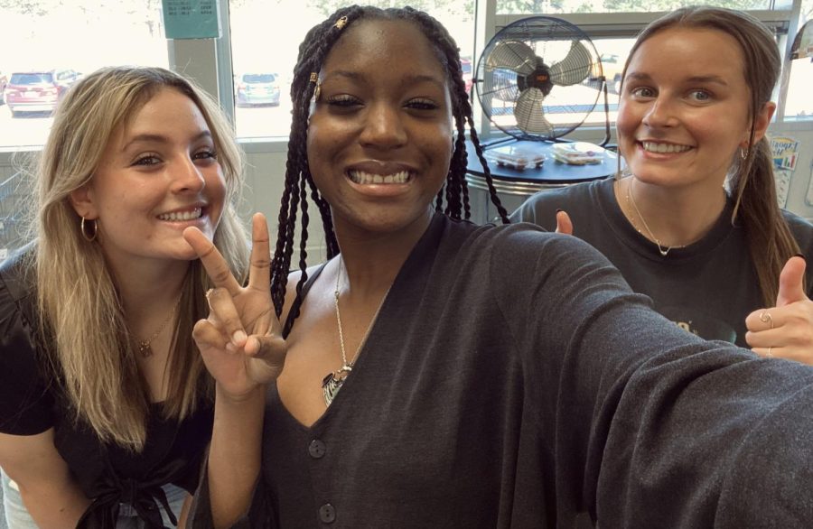The 2022-2023 journalism editors smiling 
proudly together and showing their excitement with thumbs up and peace signs! Featured from left to right is junior Maddie Chidester, senior Mia Holland, and senior Savannah Braden. 