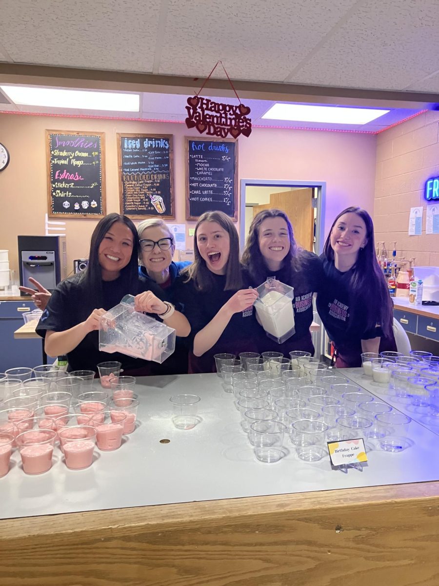 DECA Officers provide free Frappuccino samples to prospective Kadets. From left to right, Addison Keady, Alyssa Johnson (DECA advisor), Avery Senkoff, Mckenna Farrell, and Abigail Weaver.